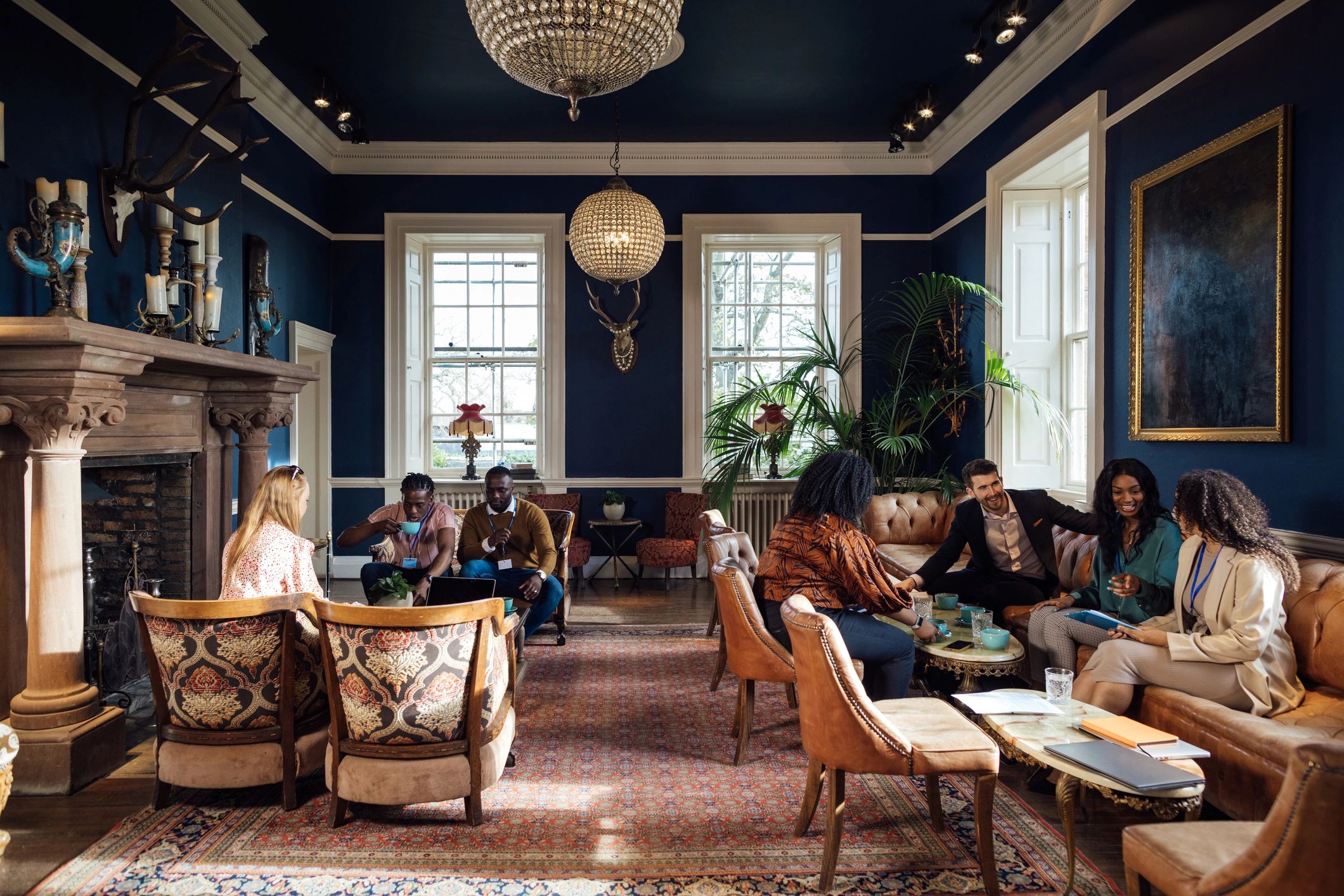 Professionals networking in a decorated event space