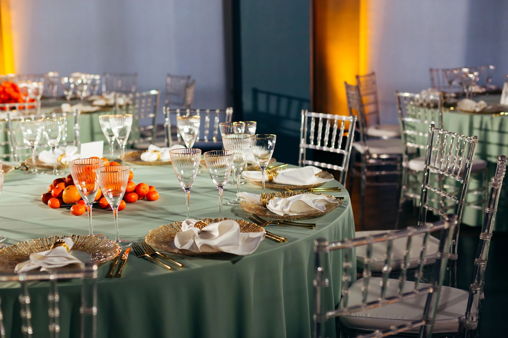 Elegant event rental setup with banquet tables and chairs